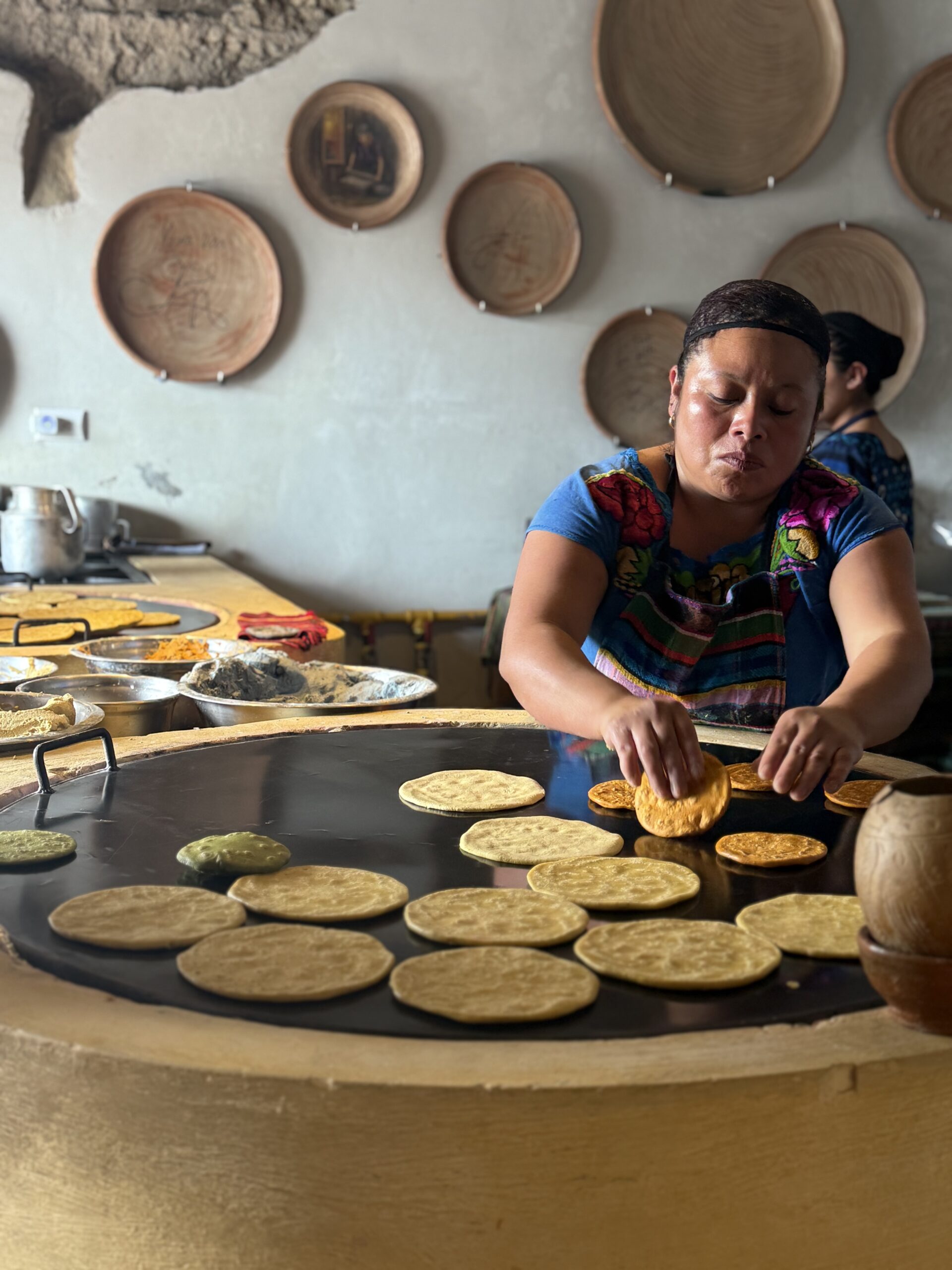 Learning traditional tortilla making with local women in Antigua Guatemala